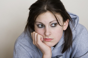 Young woman thinking about her credit problems